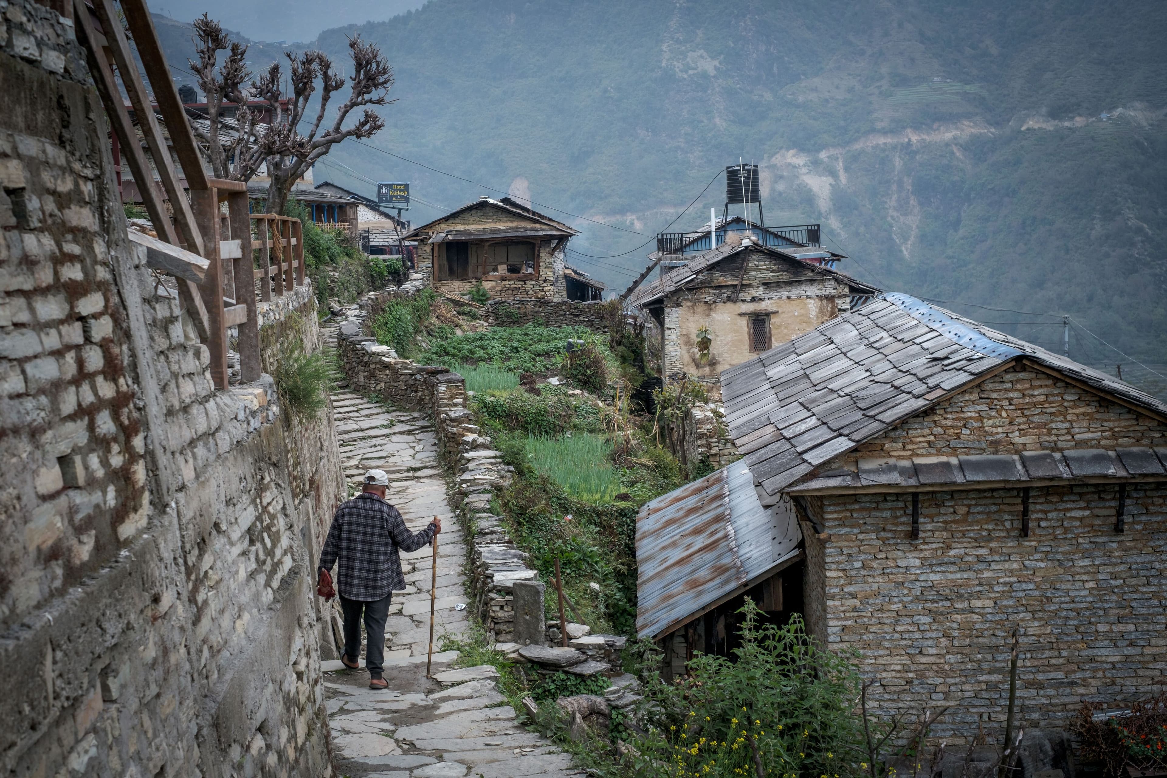 man-walking-with-stick